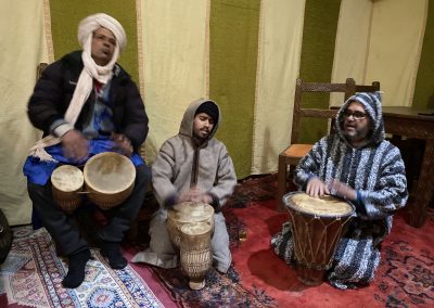 Play drums with locals in the desert of Merzouga