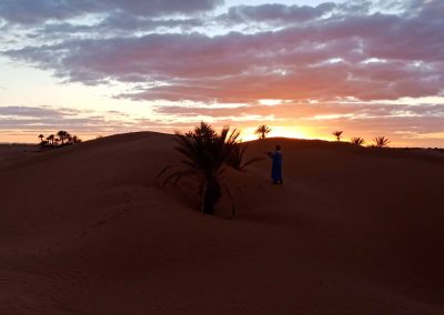 Sahara Desert and enjoy Sunset above big dunes of Mhamid